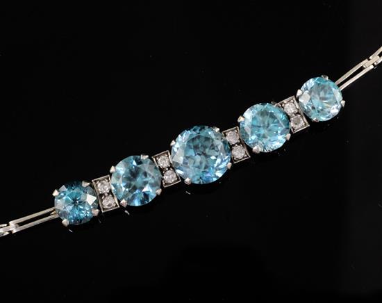 A mid 20th century white gold, graduated blue zircon and diamond set bracelet, approx. 16cm.